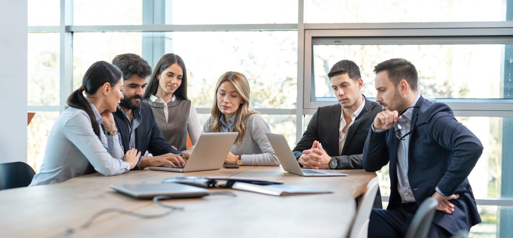 Team members in a meeting discussing AI implementation