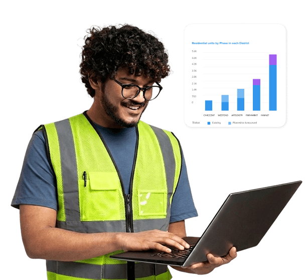Field services worker reviewing sponsorship data on laptop