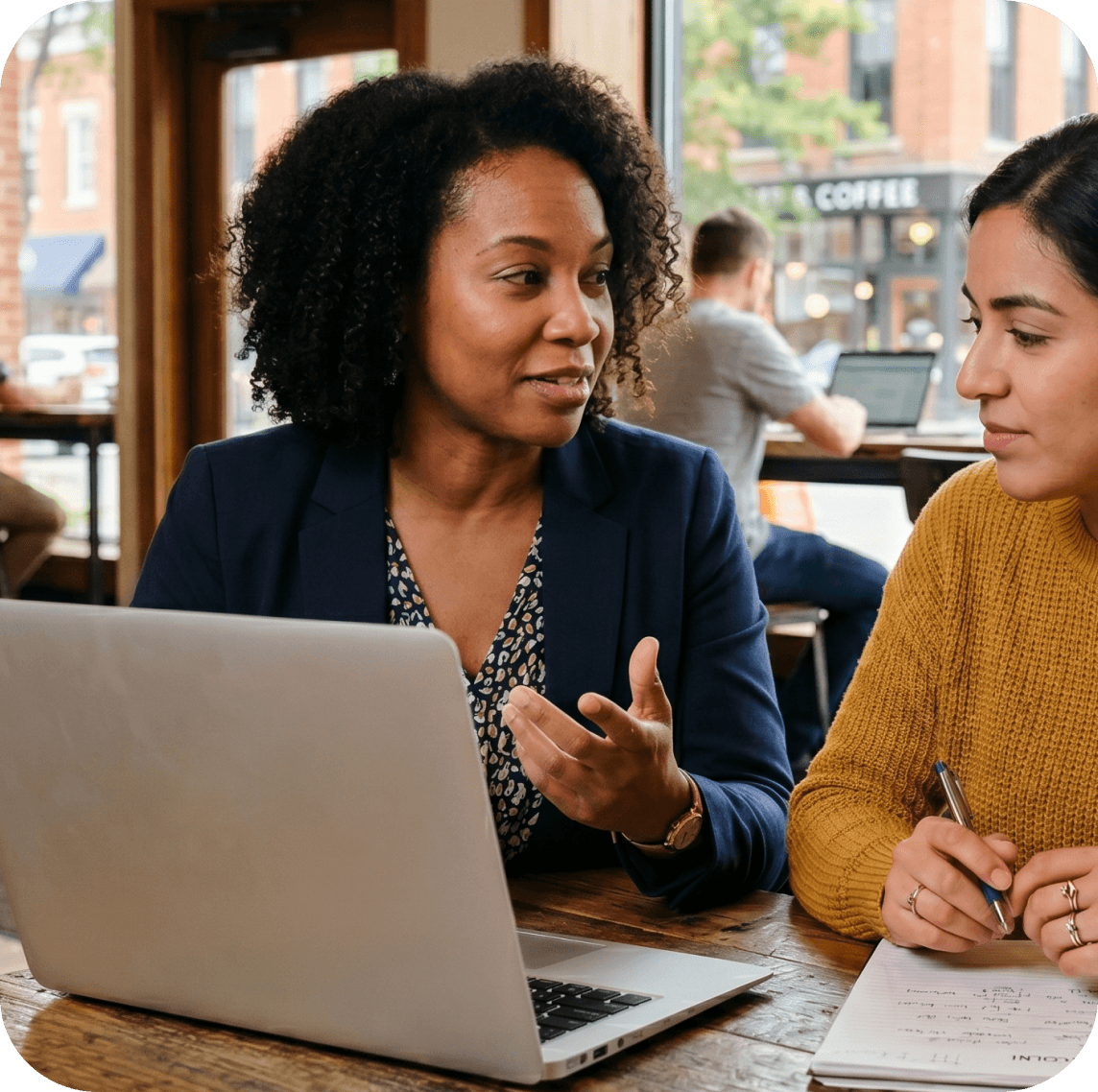 District director discussing MemberHub platform with team member