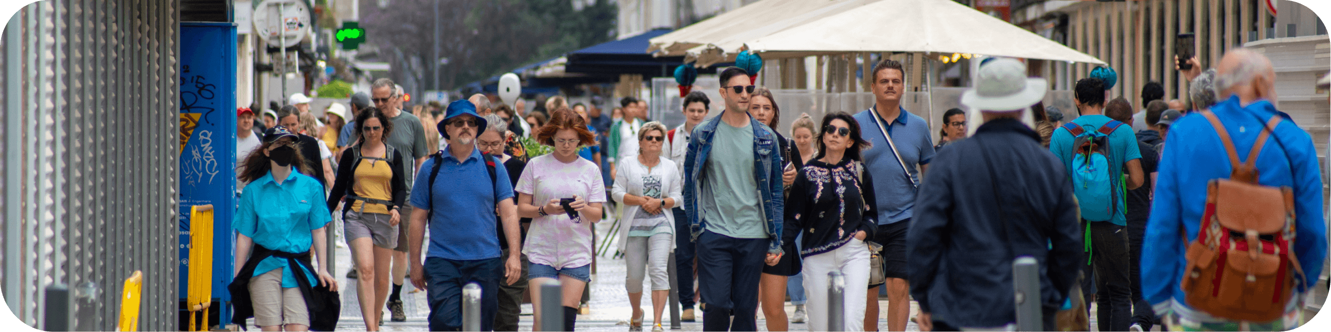 Busy pedestrian district street with people walking